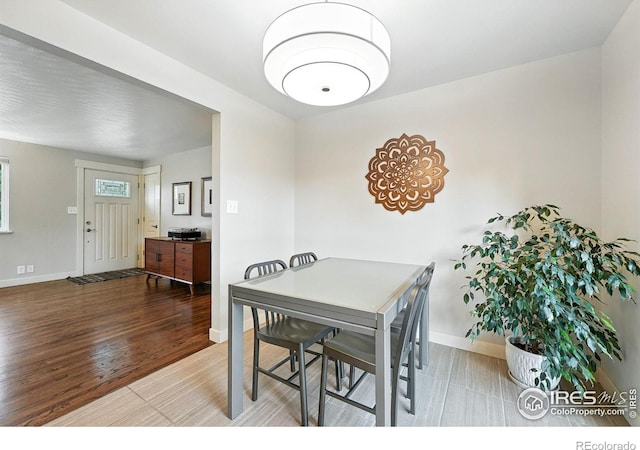 1217 Sycamore St, Fort Collins, CO 80521 - dining room featuring baseboards and wood finished floors