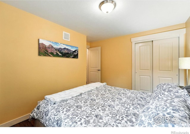 1217 Sycamore St, Fort Collins, CO 80521 - bedroom featuring a closet and wood finished floors
