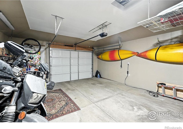1217 Sycamore St, Fort Collins, CO 80521 - garage featuring a garage door opener