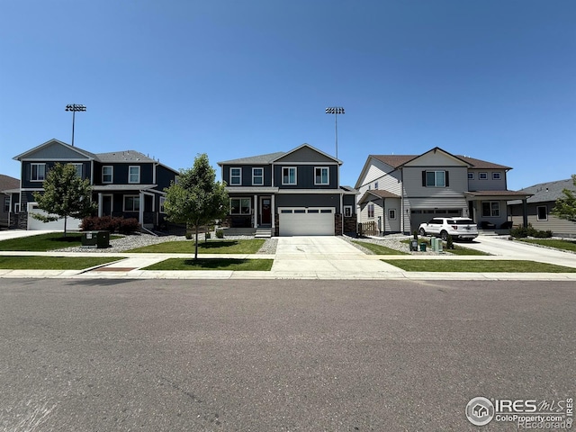 117 N 66th Ave, Greeley, CO 80634 - view of front of home featuring a garage, driveway, and a residential view