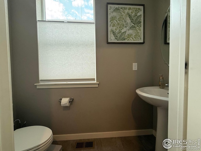 117 N 66th Ave, Greeley, CO 80634 - bathroom featuring toilet and baseboards