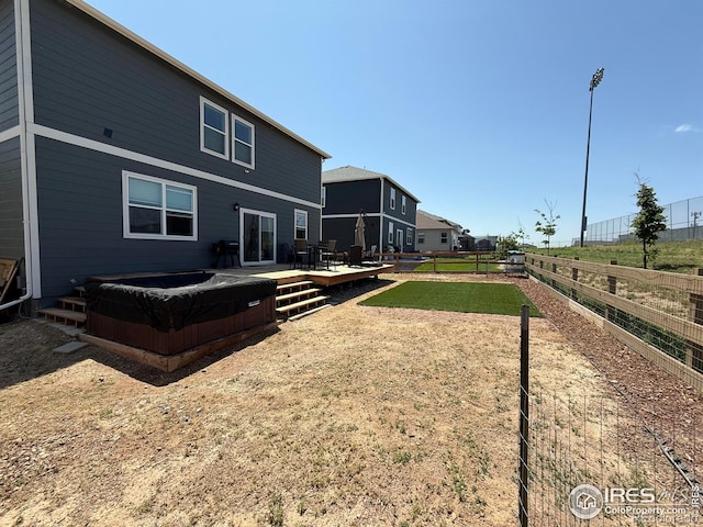 117 N 66th Ave, Greeley, CO 80634 - back of property with a fenced backyard and a deck