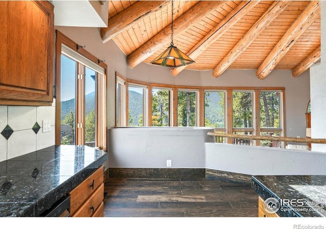 24043 Eagle Cliff Trl, Conifer, CO 80433 - kitchen featuring a wood ceiling with exposed beams, dark wood-style floors, brown cabinets, tile counters, and pendant lighting