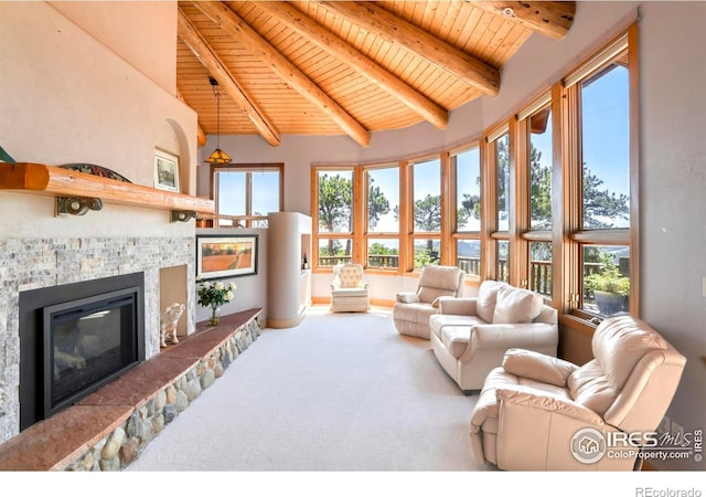 24043 Eagle Cliff Trl, Conifer, CO 80433 - living room with a wooden ceiling with exposed beams, a fireplace, carpet floors, and high vaulted ceiling