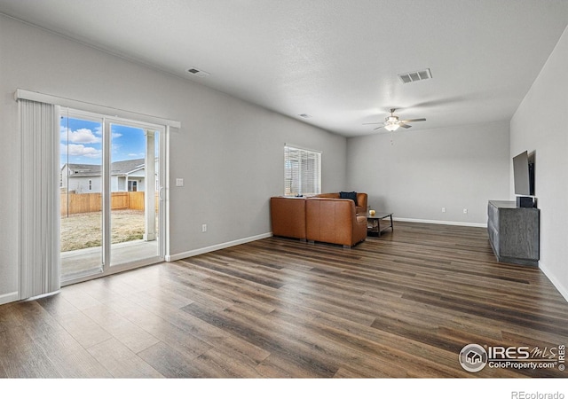 2310 Angus St, Mead, CO 80542 - unfurnished living room featuring dark wood finished floors and a ceiling fan