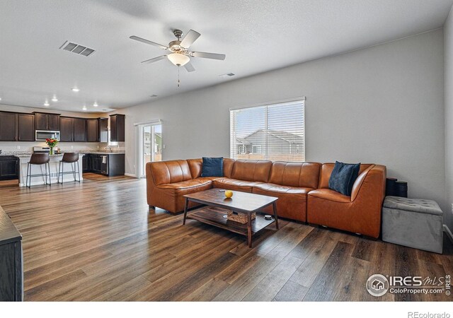 2310 Angus St, Mead, CO 80542 - living room featuring dark wood finished floors, ceiling fan, and recessed lighting