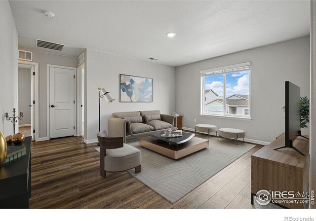 2310 Angus St, Mead, CO 80542 - living room featuring dark wood-type flooring and recessed lighting
