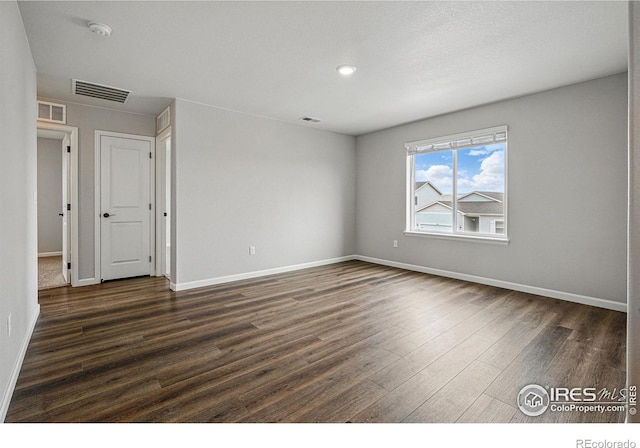 2310 Angus St, Mead, CO 80542 - unfurnished room featuring dark wood-type flooring and a smoke detector
