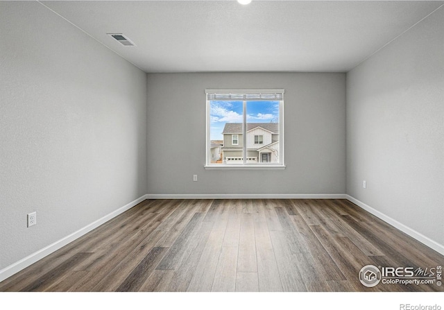 2310 Angus St, Mead, CO 80542 - spare room with wood finished floors and baseboards