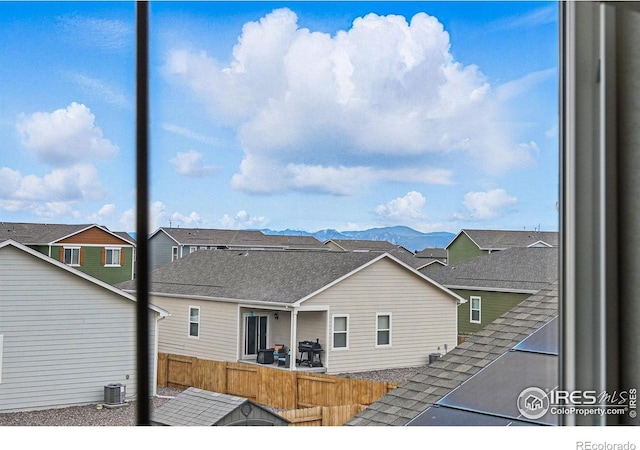 2310 Angus St, Mead, CO 80542 - back of property featuring a balcony, a mountain view, a shingled roof, and a residential view