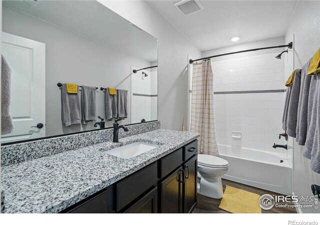 2310 Angus St, Mead, CO 80542 - bathroom featuring vanity, shower / tub combo, and wood finished floors