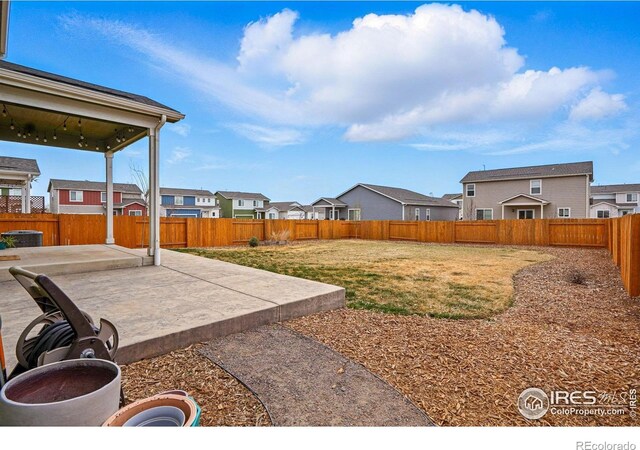2310 Angus St, Mead, CO 80542 - fenced backyard featuring a patio and a residential view
