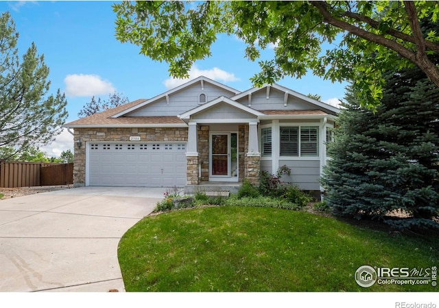 2384 Ponderosa Pl, Erie, CO 80516 - craftsman inspired home with concrete driveway, an attached garage, and stone siding