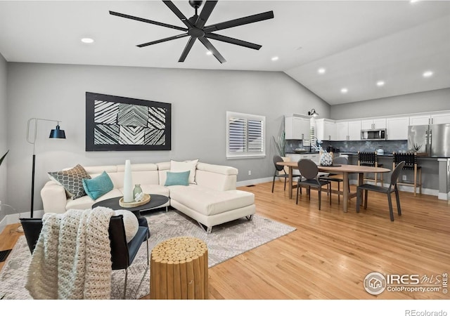 2384 Ponderosa Pl, Erie, CO 80516 - living area with a ceiling fan, lofted ceiling, light wood-type flooring, and recessed lighting