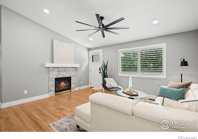 2384 Ponderosa Pl, Erie, CO 80516 - living room featuring ceiling fan, wood finished floors, a fireplace, recessed lighting, and vaulted ceiling