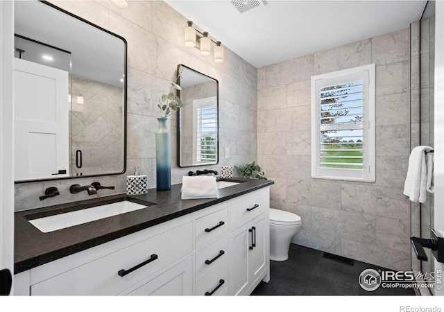 2384 Ponderosa Pl, Erie, CO 80516 - full bathroom with tile walls and double vanity