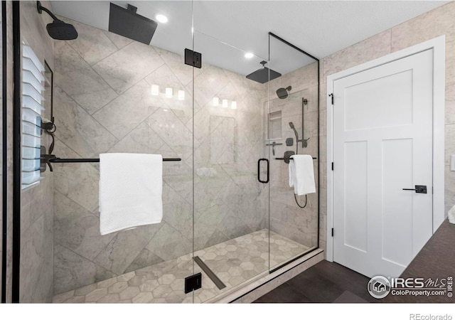 2384 Ponderosa Pl, Erie, CO 80516 - bathroom featuring a shower stall and recessed lighting