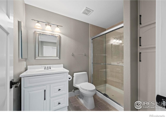 2384 Ponderosa Pl, Erie, CO 80516 - bathroom with vanity, a stall shower, tile patterned floors, and a textured wall