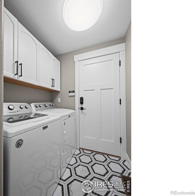 2384 Ponderosa Pl, Erie, CO 80516 - washroom featuring washer and clothes dryer, cabinet space, and light flooring