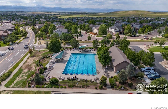 2384 Ponderosa Pl, Erie, CO 80516 - aerial view of residential area featuring a pool
