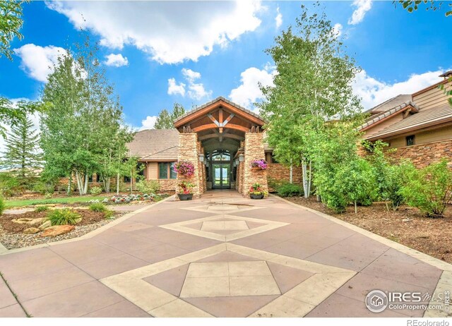 2384 Ponderosa Pl, Erie, CO 80516 - view of front of house featuring french doors and stone siding