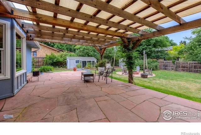 419 Centennial Dr, Louisville, CO 80027 - fenced backyard with a patio, a storage unit, a fire pit, and a pergola