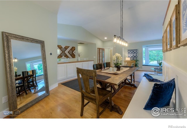 419 Centennial Dr, Louisville, CO 80027 - dining area with light wood-style flooring and lofted ceiling