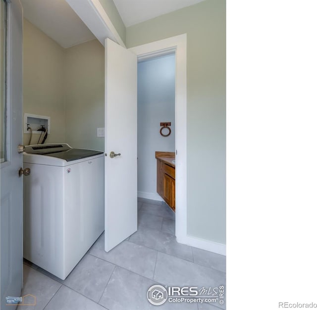 419 Centennial Dr, Louisville, CO 80027 - laundry room with washer / dryer and light tile patterned floors