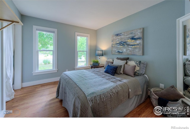 419 Centennial Dr, Louisville, CO 80027 - bedroom with wood finished floors and baseboards