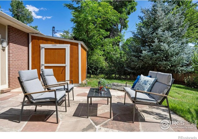1260 Claremont Dr, Boulder, CO 80305 - view of patio featuring a storage unit and outdoor lounge area