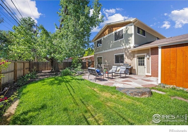 1260 Claremont Dr, Boulder, CO 80305 - fenced backyard featuring a patio and an outdoor hangout area