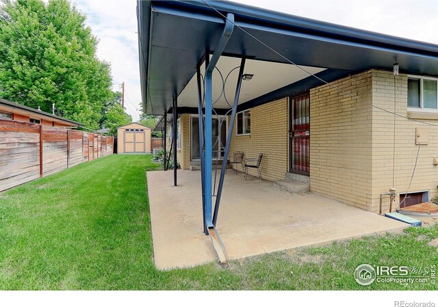 353 S Niagara St, Denver, CO 80224 - view of patio featuring a shed and entry steps