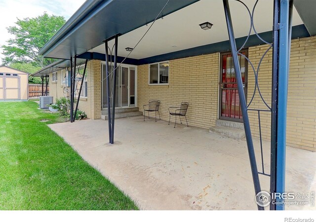 353 S Niagara St, Denver, CO 80224 - view of patio / terrace with entry steps and a storage shed