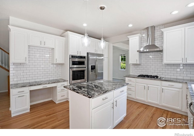 10216 Sandy Ridge Ct, Firestone, CO 80504 - kitchen with stainless steel appliances, wall chimney exhaust hood, light wood-type flooring, decorative backsplash, and recessed lighting