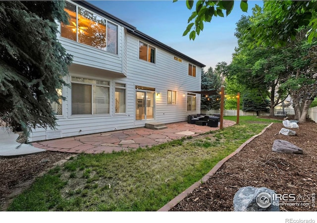 10216 Sandy Ridge Ct, Firestone, CO 80504 - back of house with a patio area