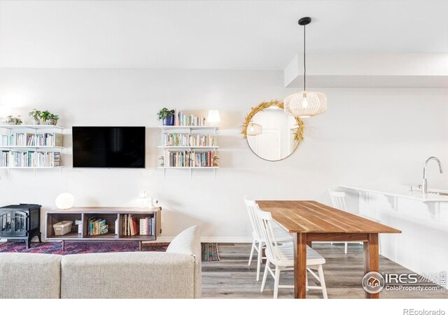 897 Winding Brook Dr, Berthoud, CO 80513 - living area featuring wood finished floors and a wood stove