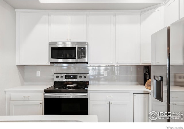 897 Winding Brook Dr, Berthoud, CO 80513 - kitchen featuring appliances with stainless steel finishes, light countertops, and white cabinets