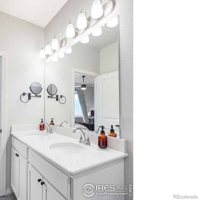 897 Winding Brook Dr, Berthoud, CO 80513 - ensuite bathroom with double vanity and a ceiling fan