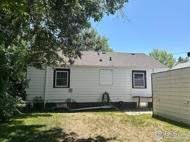 305 Euclid St, Fort Morgan, CO 80701 - rear view of property featuring a lawn