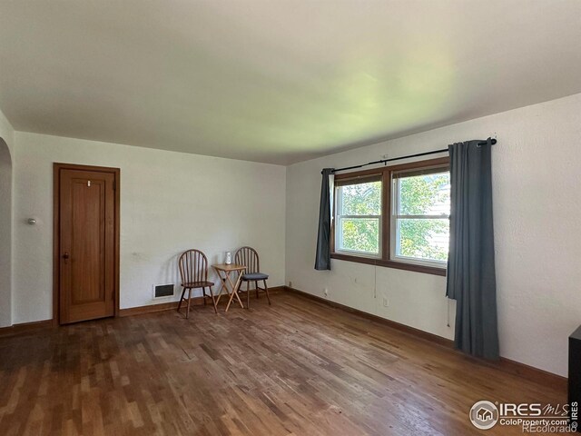 305 Euclid St, Fort Morgan, CO 80701 - unfurnished room with wood finished floors and arched walkways