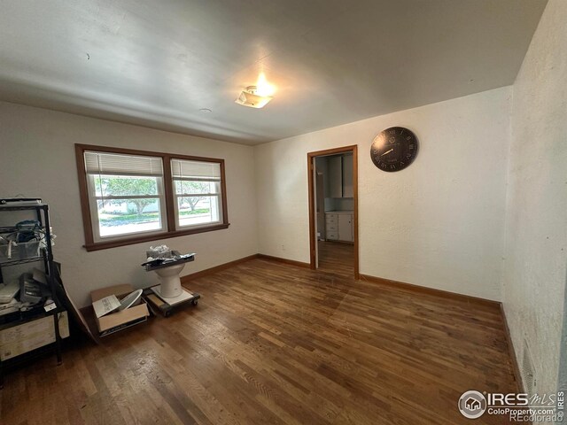 305 Euclid St, Fort Morgan, CO 80701 - unfurnished room featuring wood finished floors and baseboards