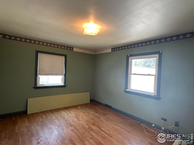 305 Euclid St, Fort Morgan, CO 80701 - unfurnished room with wood finished floors and baseboards