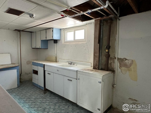 305 Euclid St, Fort Morgan, CO 80701 - below grade area with a sink and light floors