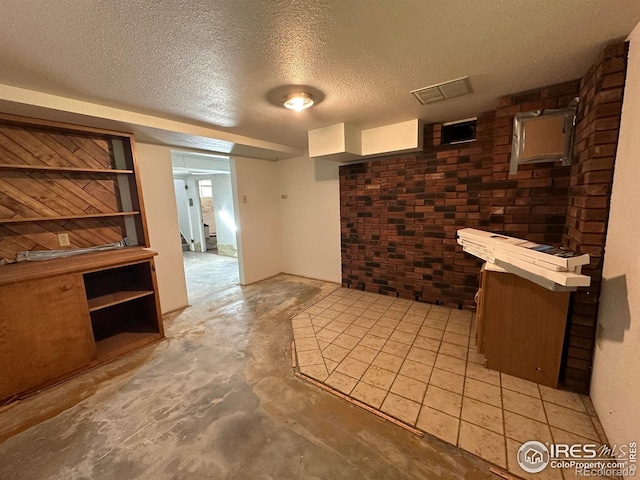 305 Euclid St, Fort Morgan, CO 80701 - bar area featuring a textured ceiling, brick wall, and concrete floors
