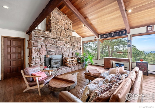 311 Sky Trail Rd, Boulder, CO 80302 - living room with a wood stove, hardwood / wood-style flooring, and a baseboard heating unit