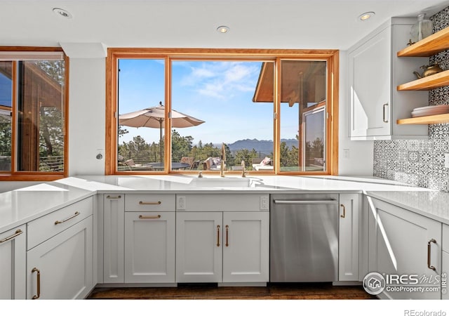 311 Sky Trail Rd, Boulder, CO 80302 - kitchen with dishwasher, open shelves, light countertops, tasteful backsplash, and a mountain view