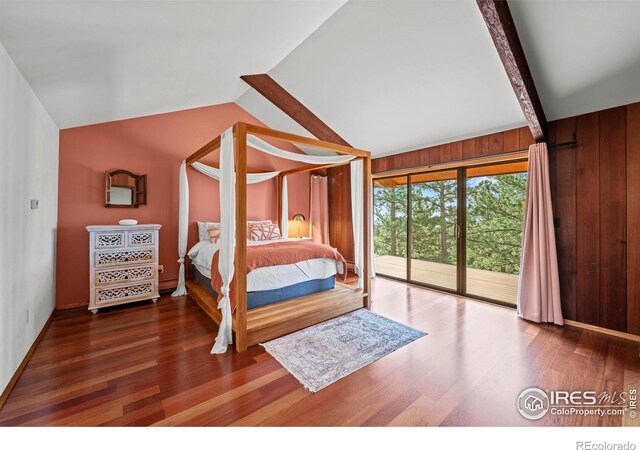 311 Sky Trail Rd, Boulder, CO 80302 - bedroom with access to exterior, wood finished floors, and wood walls