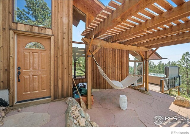 311 Sky Trail Rd, Boulder, CO 80302 - view of patio / terrace featuring a hot tub and a pergola