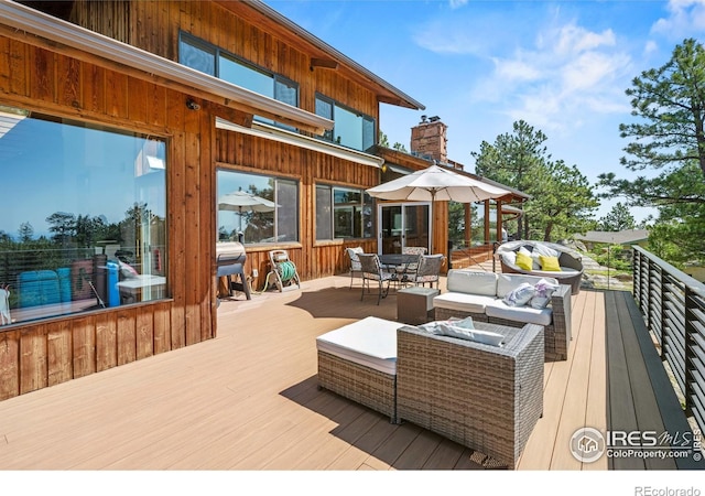 311 Sky Trail Rd, Boulder, CO 80302 - deck featuring outdoor dining area, a grill, and an outdoor living space