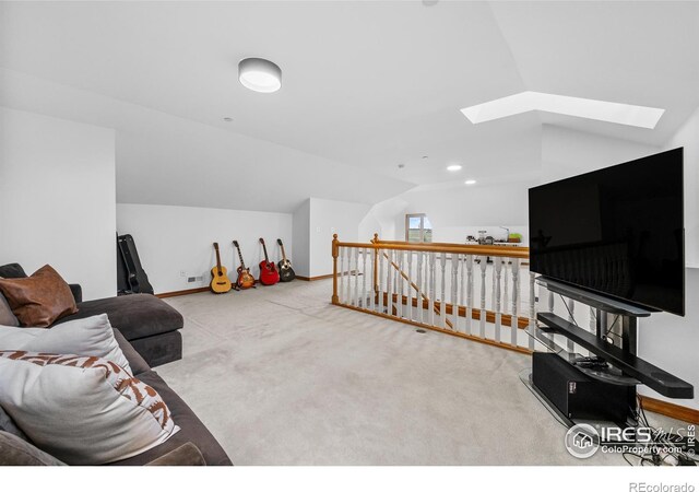 5986 Heather Way, Longmont, CO 80503 - living room with a skylight, vaulted ceiling, and carpet floors